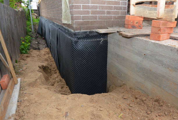 SJ Waterproofing Pros technician performing targeted Interior Drainage System assessment in Geneseo, IL